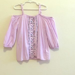 Lavender off the shoulder shirt.